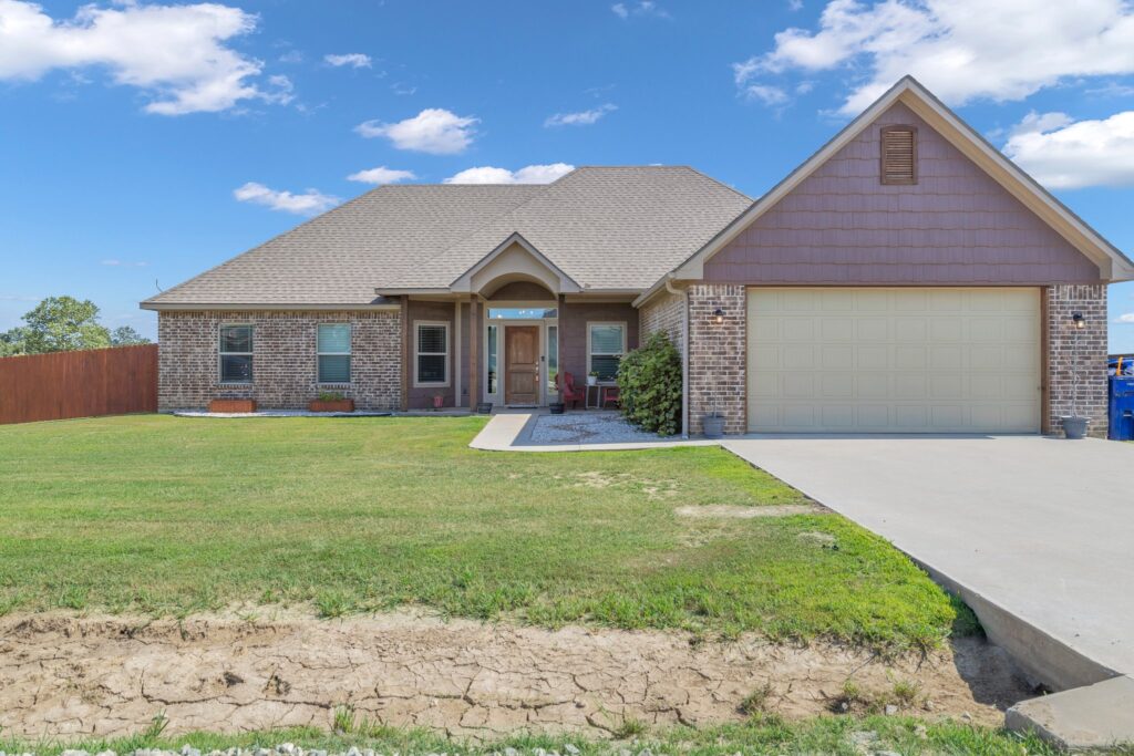 Beautiful Durant, Oklahoma home for sale in 74701 featuring a spacious lot, modern kitchen, and stunning interior design.