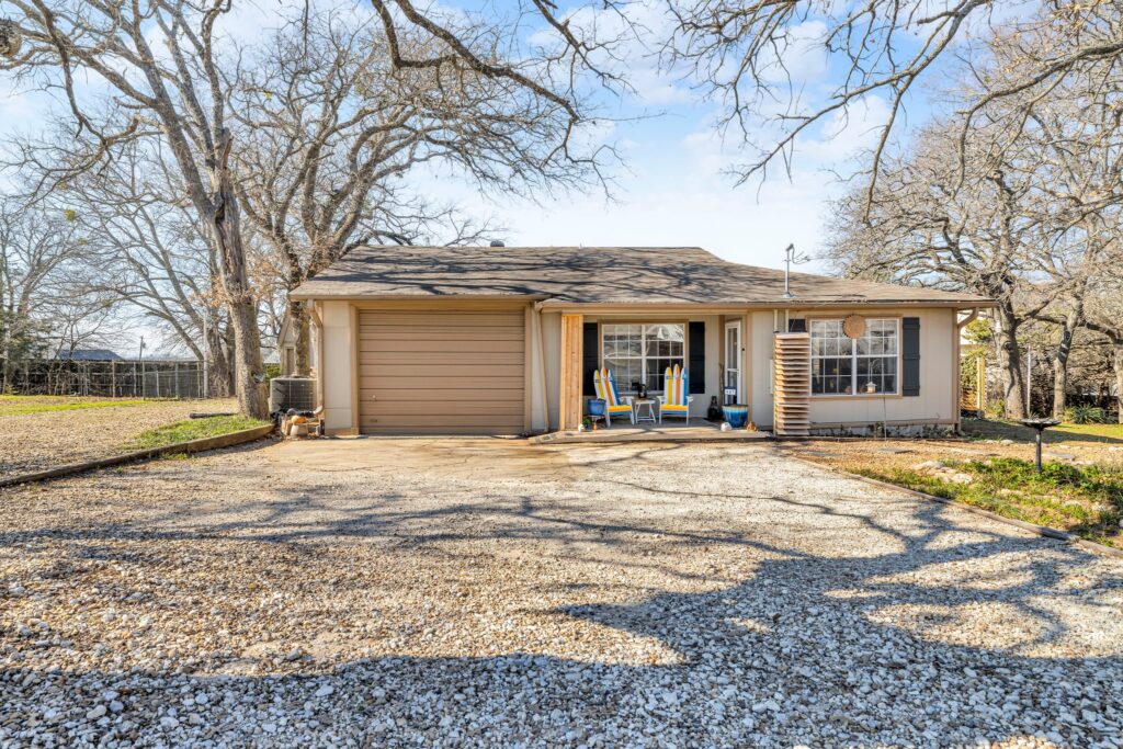 A beautifully remodeled Lake Texoma home for sale at 407 Queens Drive, Pottsboro, TX, featuring an open floor plan, lake views, and investment potential as an Airbnb or short-term rental.