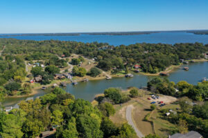 Beautiful lakefront home with spacious front yard and waterfront views at 912 Lohaina Court, Tool, TX