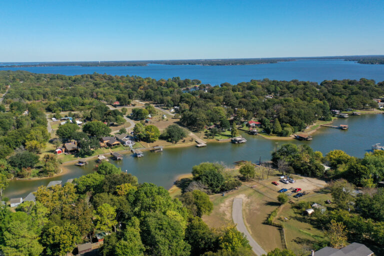 Beautiful lakefront home with spacious front yard and waterfront views at 912 Lohaina Court, Tool, TX